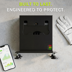 SkyTrak case mounted on wall with golf glove and companion app data screen