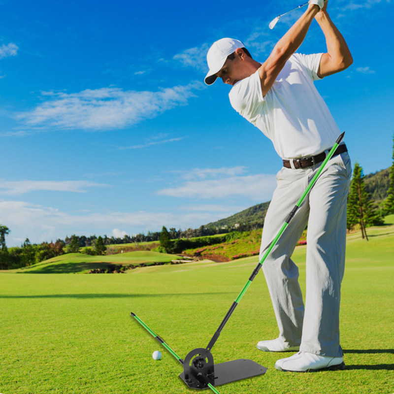 Man practicing golf swing with Steelink black swing trainer outdoors